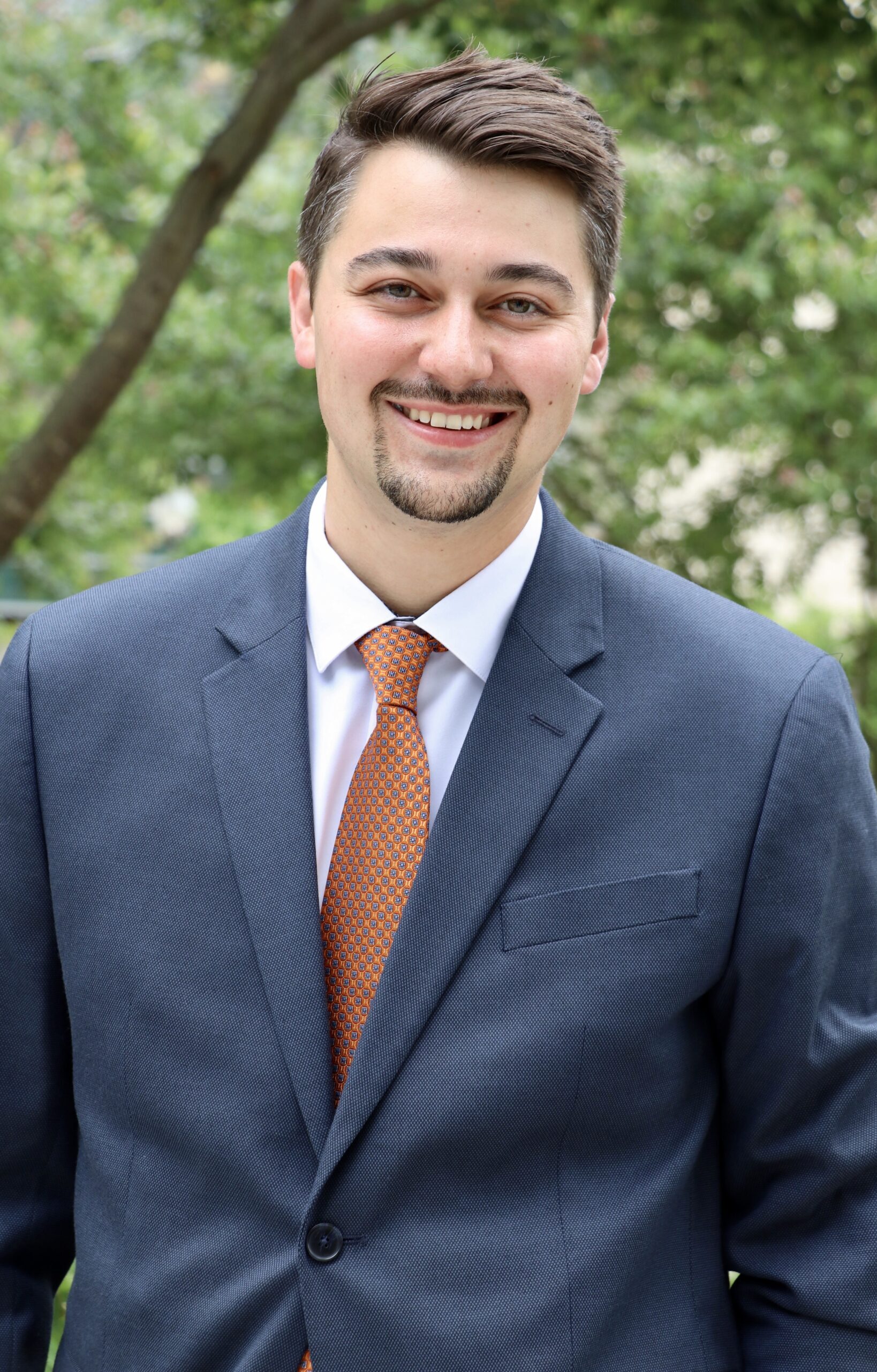 Dr. Jonathan R. Young, man smiling with trees in background